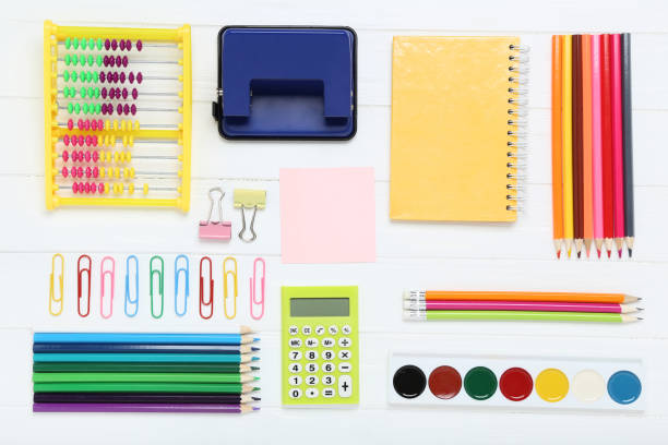 istock School supplies on white wooden table 1208335925