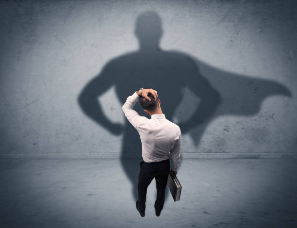 istock Successful businessman with superhero shadow 1208336309