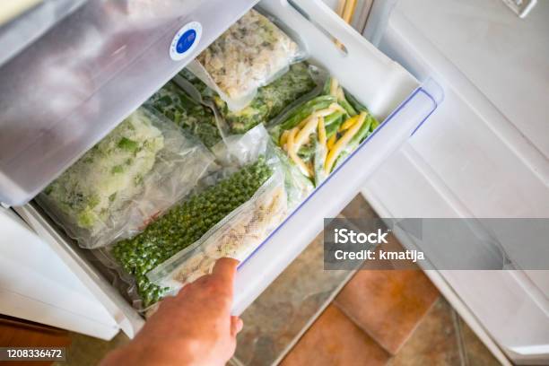 Freezer Drawer With Packed Vegetables Stock Photo - Download Image Now - Freezer, Vegetable, Frozen