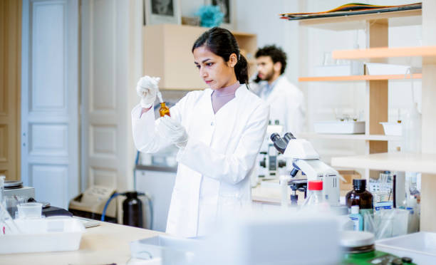 istock Scientist pippeting into a test tube 1208337161