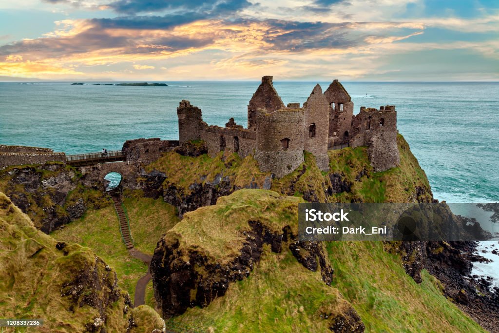 Dunluce Castle near Bushmills, Northern Ireland The iconic ruin of Dunluce Castle built on the dramatic coastal cliffs of north County Antrim by the MacQuillan family around 1500. Castle Stock Photo