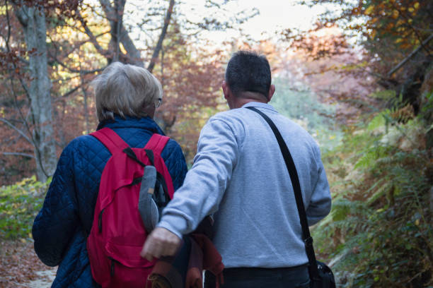 istock Active senior couple walking outdoors 1208337515