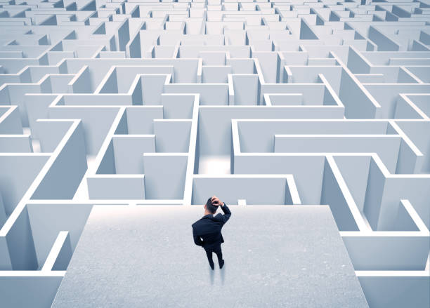 istock Businessman staring at infinite maze 1208339259