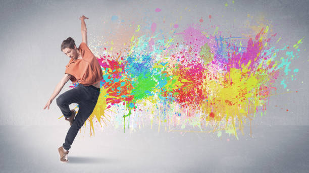 istock Young colorful street dancer with paint splash 1208341389