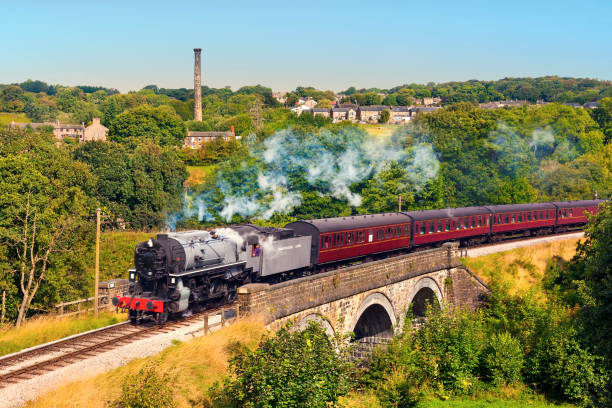 istock Railway bridge over river Worth near Oakworth in Summer 1208341445