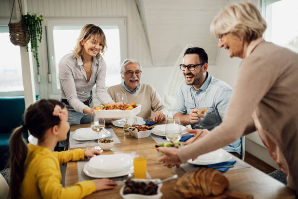 istock Cheerful multi-generation family having fun during lunch at dining table. 1208341513