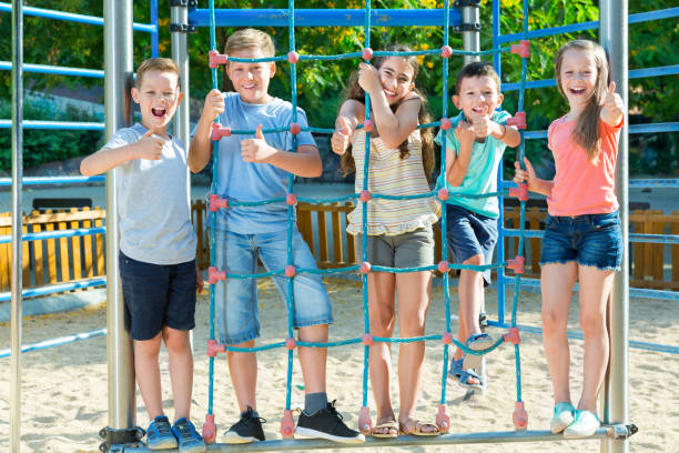 istock Happy children playing at playground 1208341541
