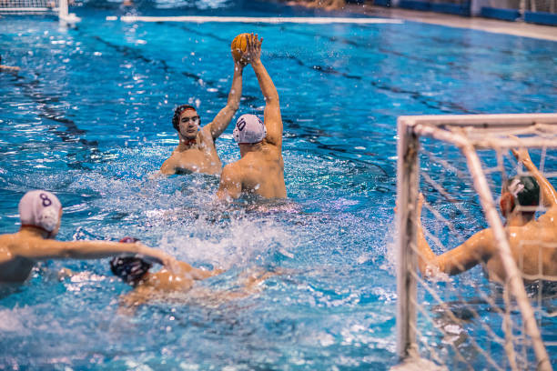 istock Young men playing water polo 1208341911