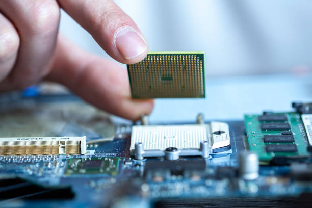 istock The technician is putting the CPU on the socket of the computer motherboard 1208342015