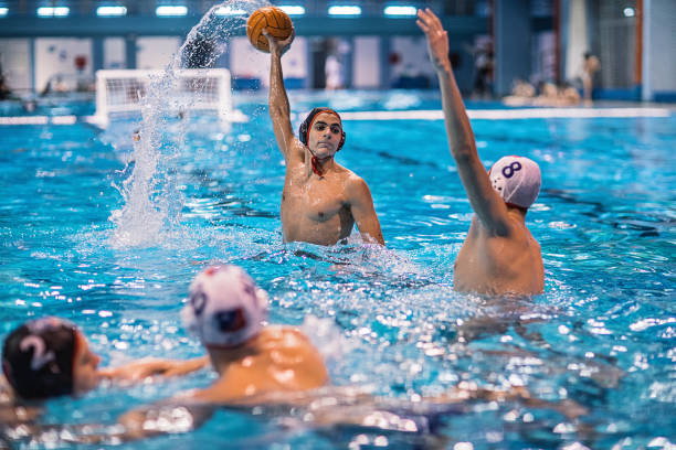istock Young men playing water polo 1208343187