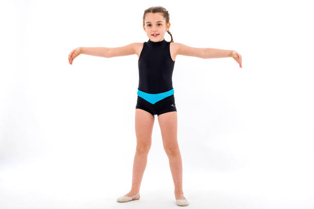 istock Girl child practice and doing rhythmic gymnastics portrait, white background. 1208344937