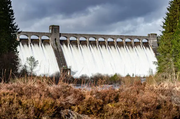 After a long period of sustained rain the level of the loch held back by this dam reached the emergency overflow sections.
The dam was built as part of a hydro electric generating scheme in Dumfries and Galloway, south west Scotland.