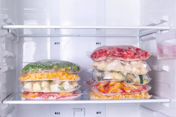 istock Bags with frozen vegetables in refrigerator 1208345919