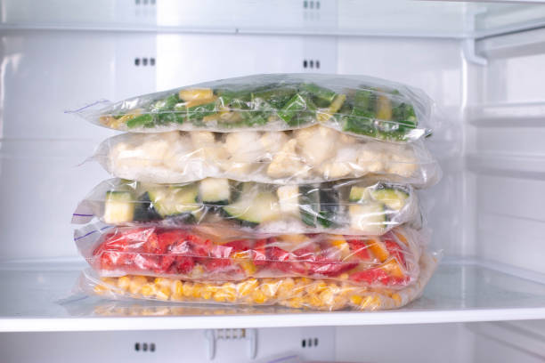 istock Bags with frozen vegetables in refrigerator 1208345952