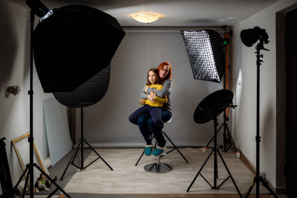 photographing children in professional photo studio with lighting equipment. - happy kid flash imagens e fotografias de stock