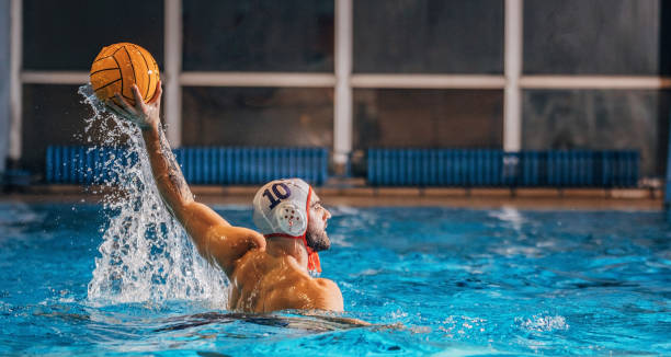istock Young man playing water polo 1208346869