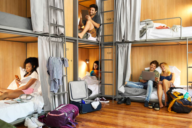 istock Multi-ethnic friends relaxing in dorm room 1208347865