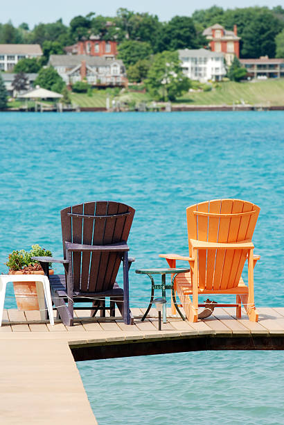 istock brown and orange adirondack chairs on a dock 120834852