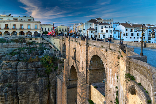 Ronda is a village in the Spanish province of Málaga. It is located about 105 km (65 mi) west of the city of Málaga, within the autonomous community of Andalusia.\nThe Puente Nuevo (\