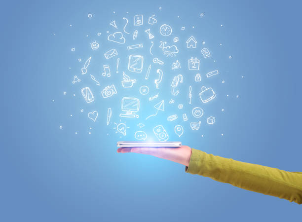 istock Hand with phone and drawn office icons 1208350827