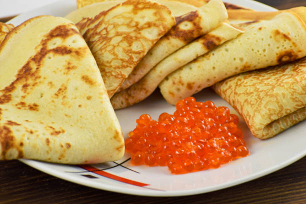 istock Traditional Russian pancakes with red caviar. 1208352116
