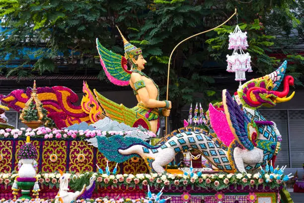 Photo of A colorful floral float depicting angels and mythical animals