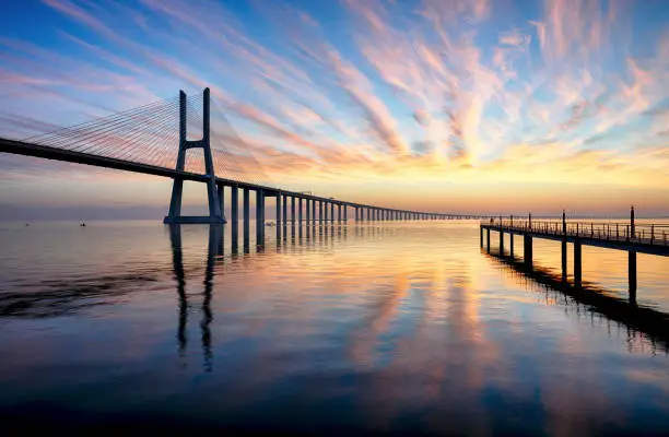 Photo of Bridge Lisbon at sunrise, Portugal - Vasco da Gamma