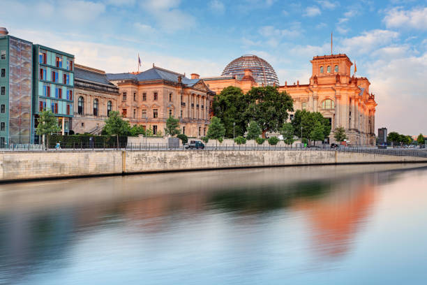 istock Reichstag with reflection in Spree, Berlin 1208355234