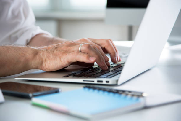 istock Closeup of businessman's hands working with laptop 1208356550