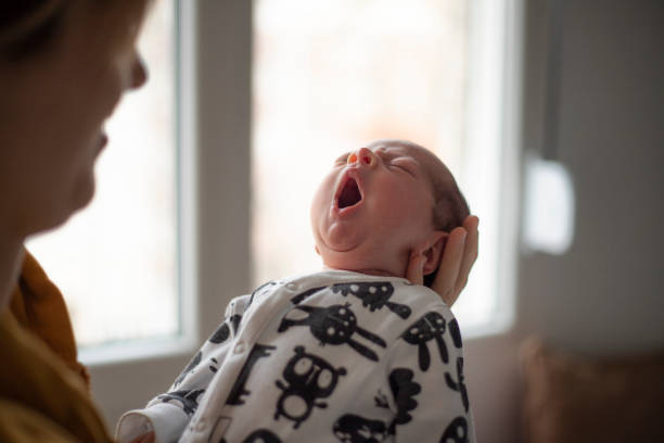 istock Closeup Newborn Baby Yawning 1208357085