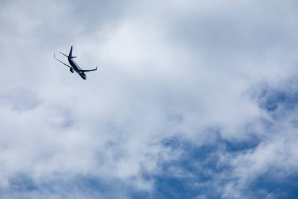 istock airplane in sky travel concept 1208357671