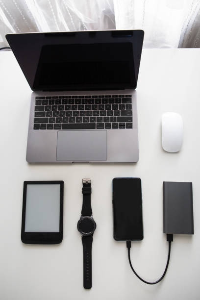 istock flatlay of different objects as laptop computer mouse phone smart watch e-book powerbank cellphone 1208357689