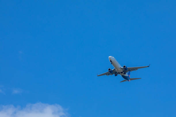 istock airplane in sky travel concept 1208357695