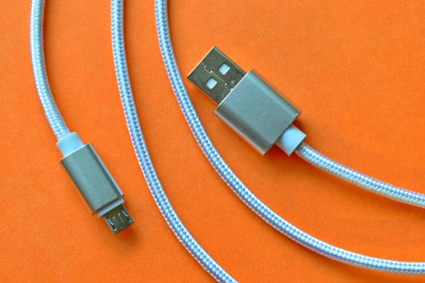 white micro usb cable close up - electric plug electricity power cable imagens e fotografias de stock