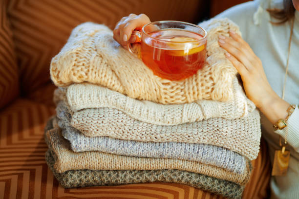 istock Closeup on elegant woman with sweaters and tea 1208358781