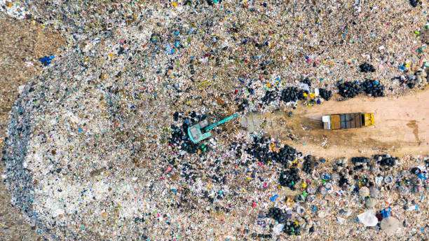 istock Ecosystem and healthy environment concepts and background, Garbage pile in trash dump or landfill, Aerial view garbage trucks unload garbage to a landfill, global warming. 1208359074