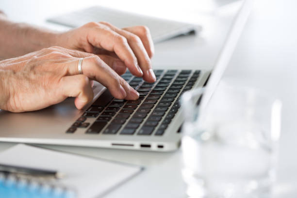 istock Closeup of businessman's hands working with laptop 1208361504