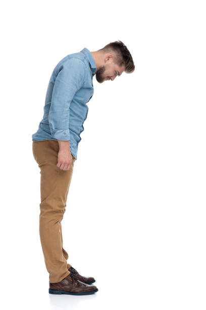 istock Side view of a eager casual man curiously looking down 1208362437