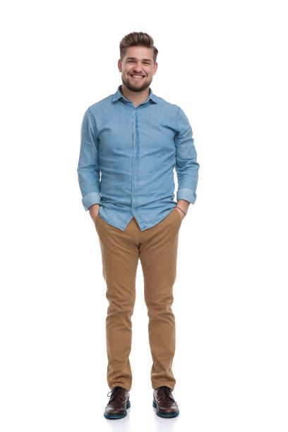 istock Positive casual man laughing with both hands in his pockets 1208362588