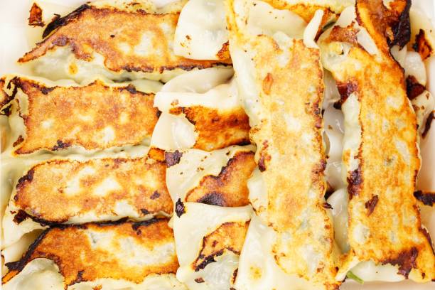 istock Leek and pork pan fried dumplings 1208362672