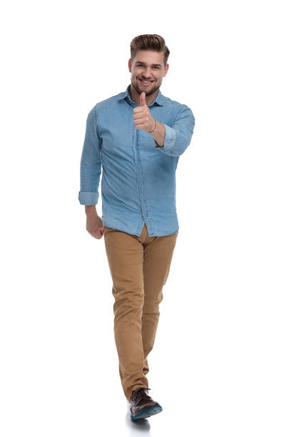 istock Cheerful casual man smiling and giving a thumbs up 1208362814