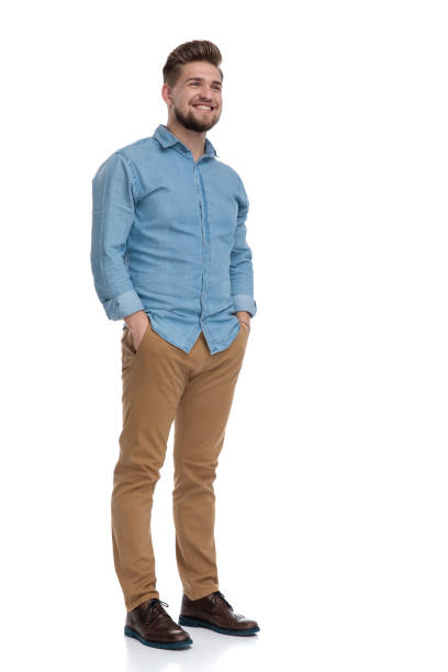 istock Happy casual man smiling with his hands in his pockets 1208362856