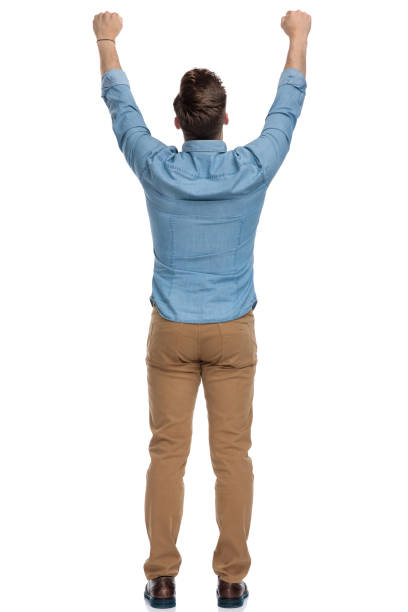 istock Rear view of a celebrating casual man 1208362876