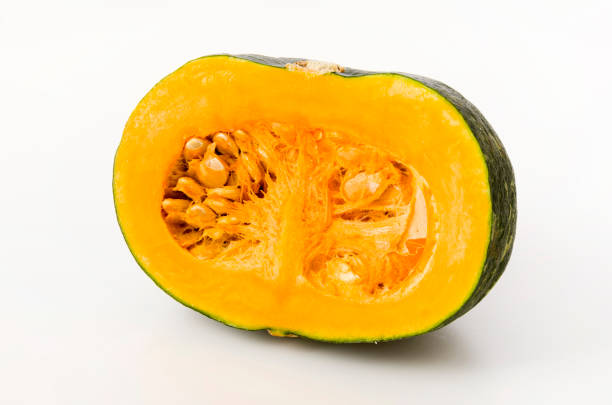 Half cut kabocha squash isolated on white background Half cut kabocha squash isolated on white background kabocha stock pictures, royalty-free photos & images