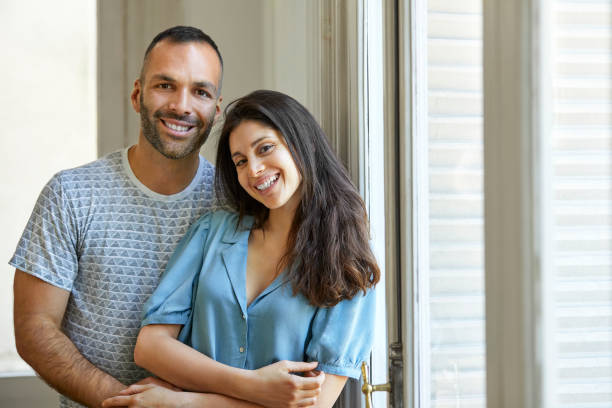 istock Happy heterosexual couple at home 1208363387