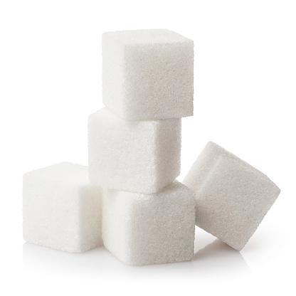 Pyramid of sugar cubes, isolated on white background