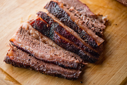 Beef Brisket barbecue Traditional Texas Smoke House . Rubbed with spiced & slow smoked in a classic Texas smoke house over mesquite wood chips in traditional classic bbq method. Chopped Beef Brisket.