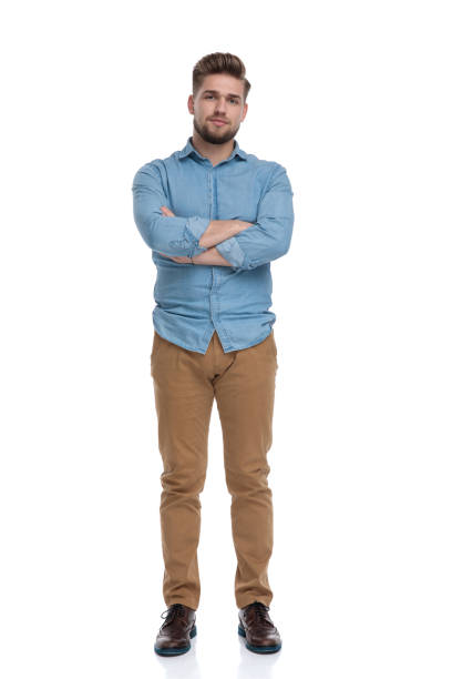 istock Serious casual man holding his hands folded 1208364411