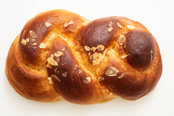 istock Easter greek tsoureki braid, sweet bread brioche isolated on white 1208364525