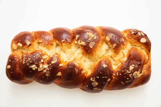 istock Easter greek tsoureki braid, sweet bread brioche isolated on white 1208364546